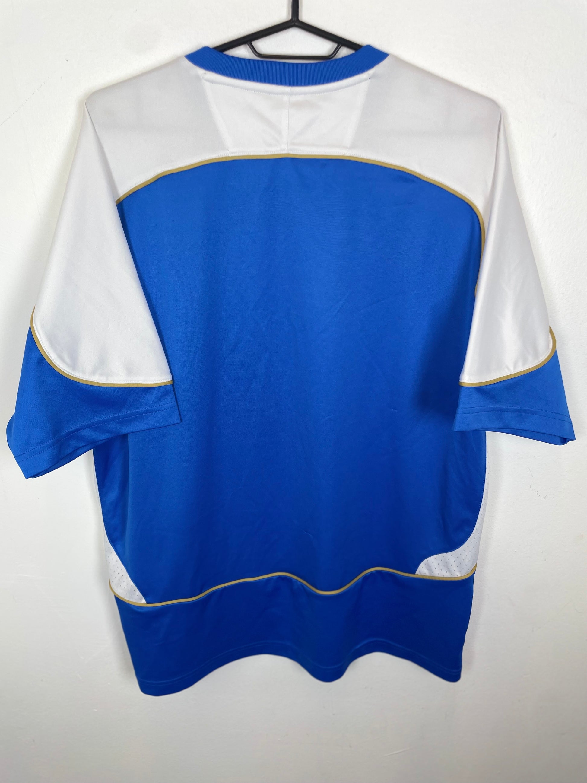 Blue and white Wigan Athletic Home 06/07 jersey on a hanger against a white background