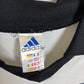 Close-up of Club Brugge club badge and manufacturer logo on 98/99 away shirt in excellent condition