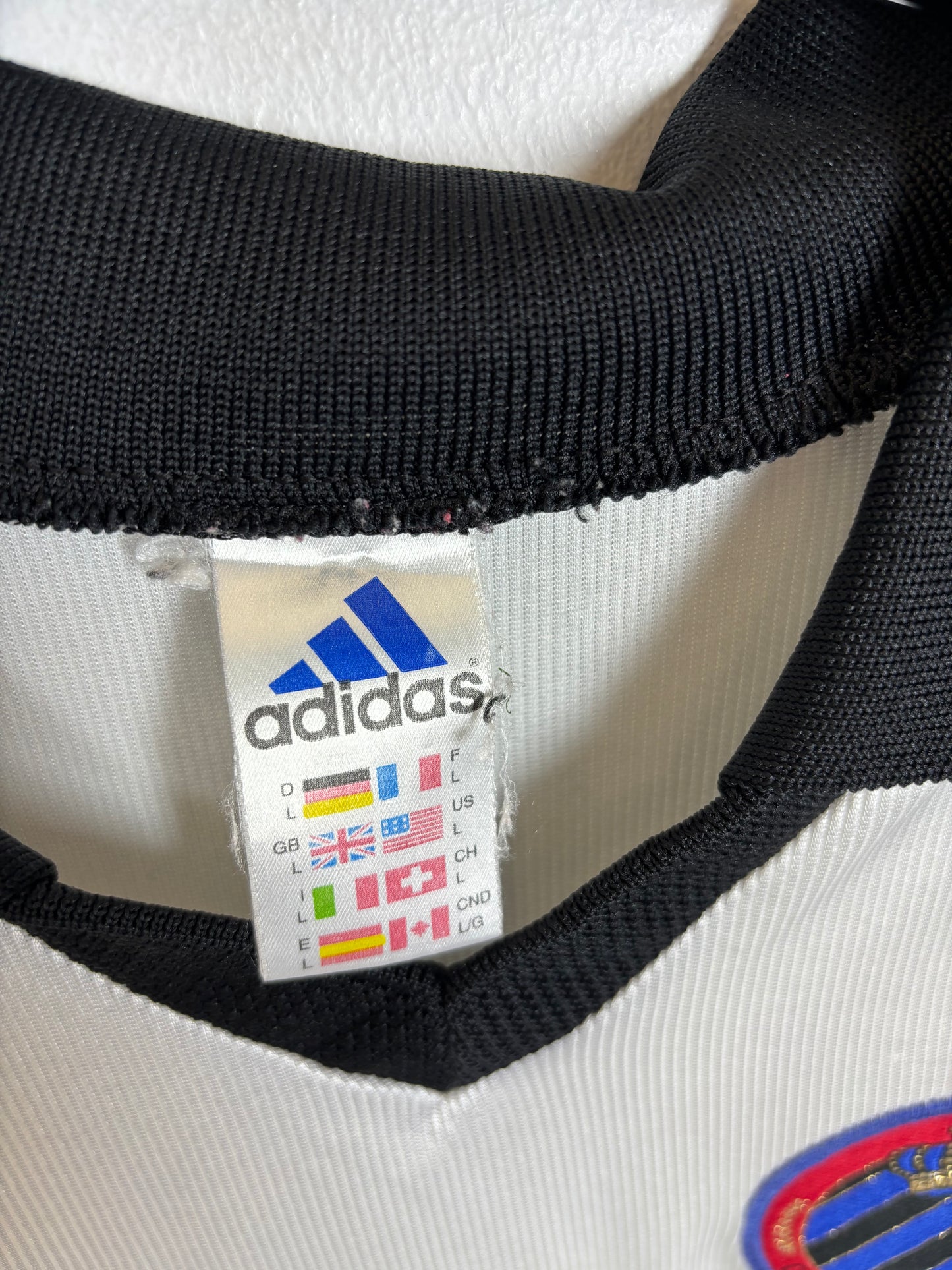 Close-up of Club Brugge club badge and manufacturer logo on 98/99 away shirt in excellent condition