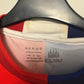 Close-up of the Paraná Clube club crest and Claw branding on the 2024 home football shirt
