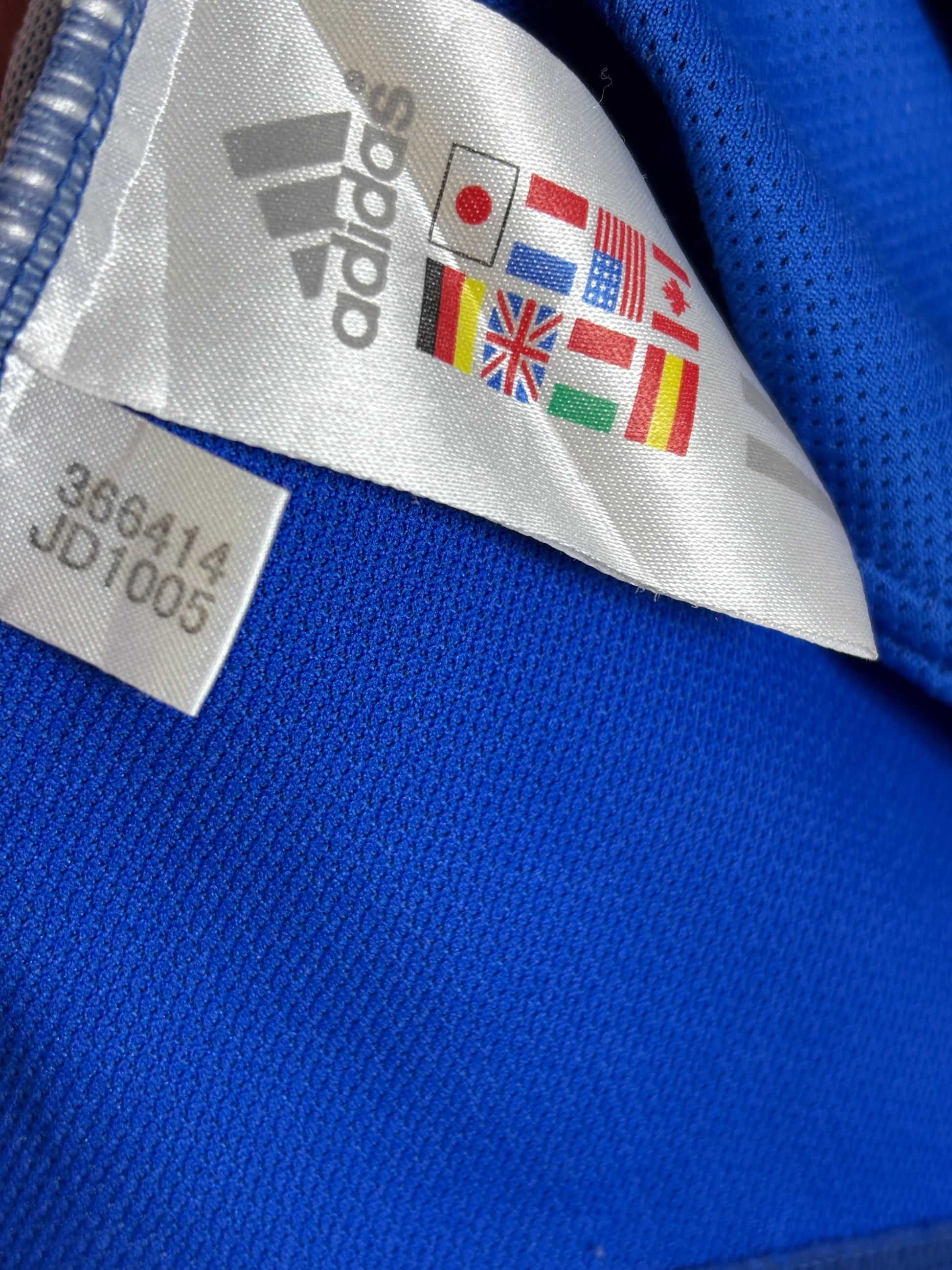 Detailed fabric texture and stitching quality view of Adidas Japan 2006 Nakamura home shirt