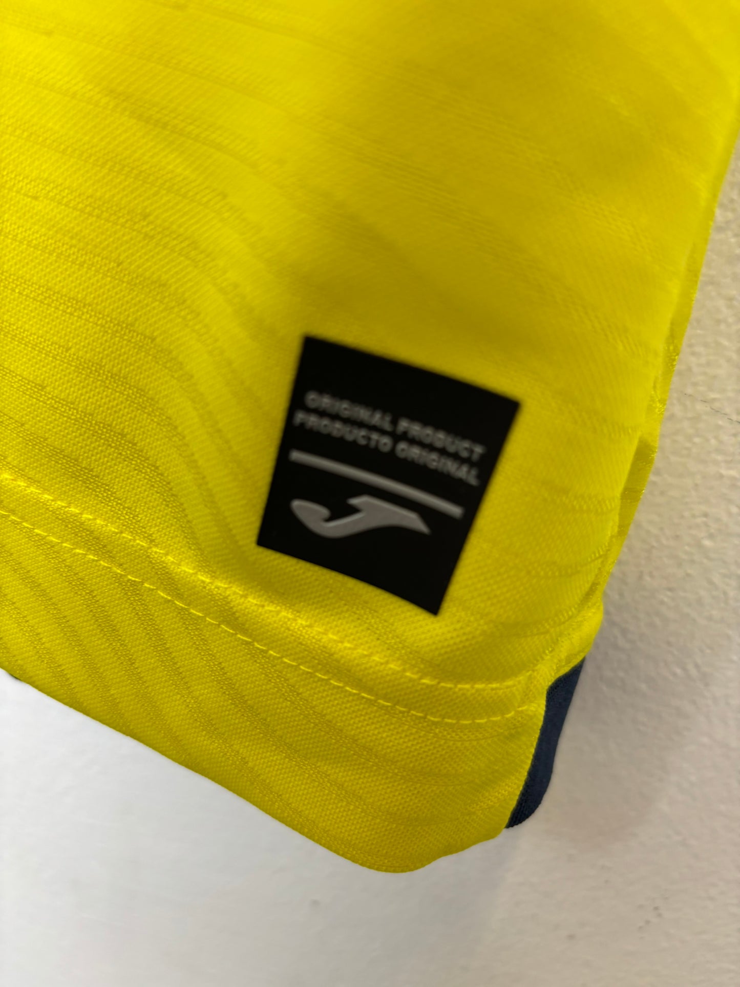 Joma Villareal 23/24 home shirt sponsor and sleeve detail close-up with R. Albiol 3