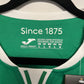 Green and white 80s with 'Since 1875' text and brand logo.