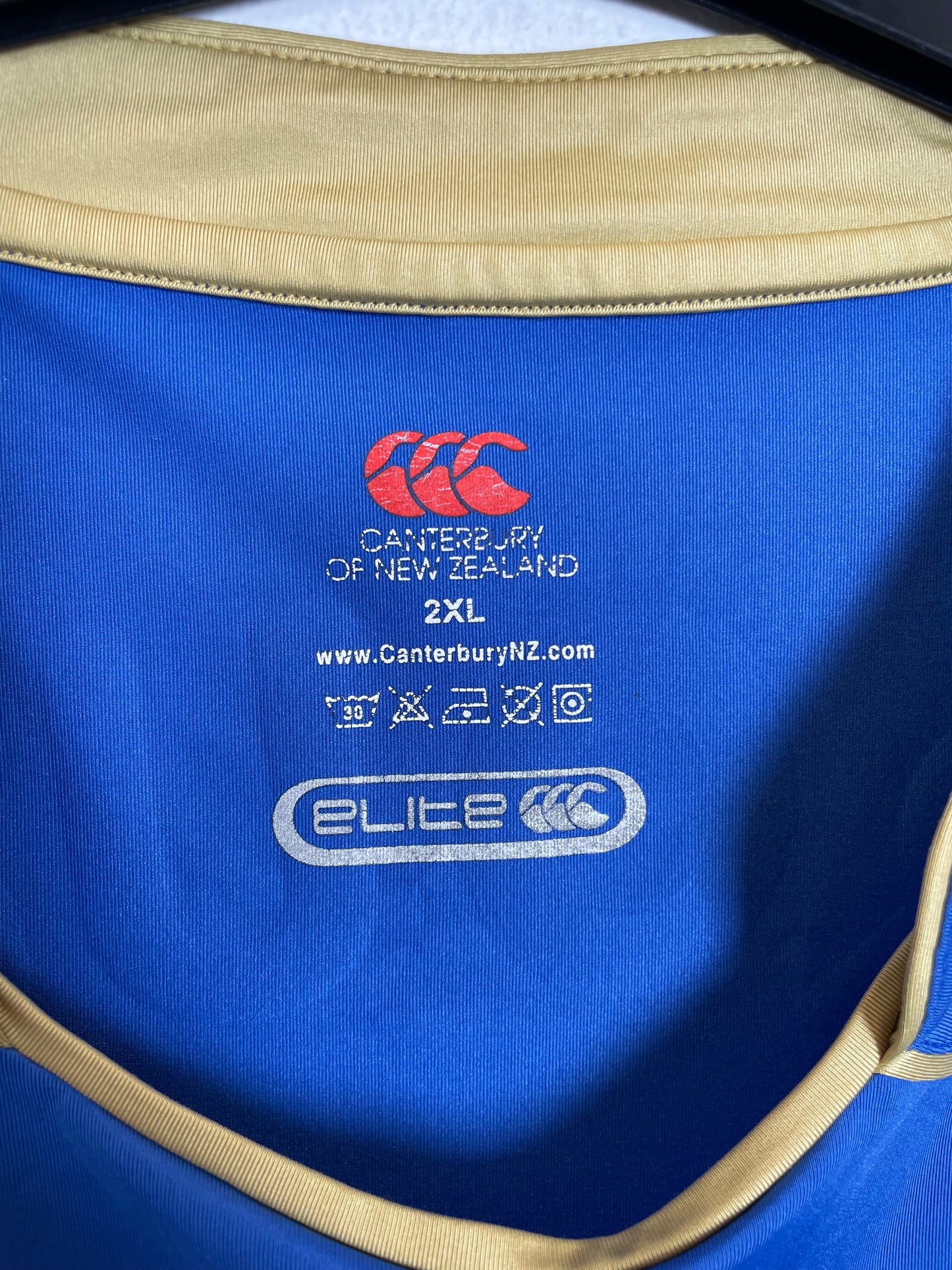 Close-up of Canterbury logo and Portsmouth FC club badge on blue home shirt 08/09
