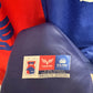 Close-up of the Paraná Clube club crest and Claw branding on the 2024 home football shirt