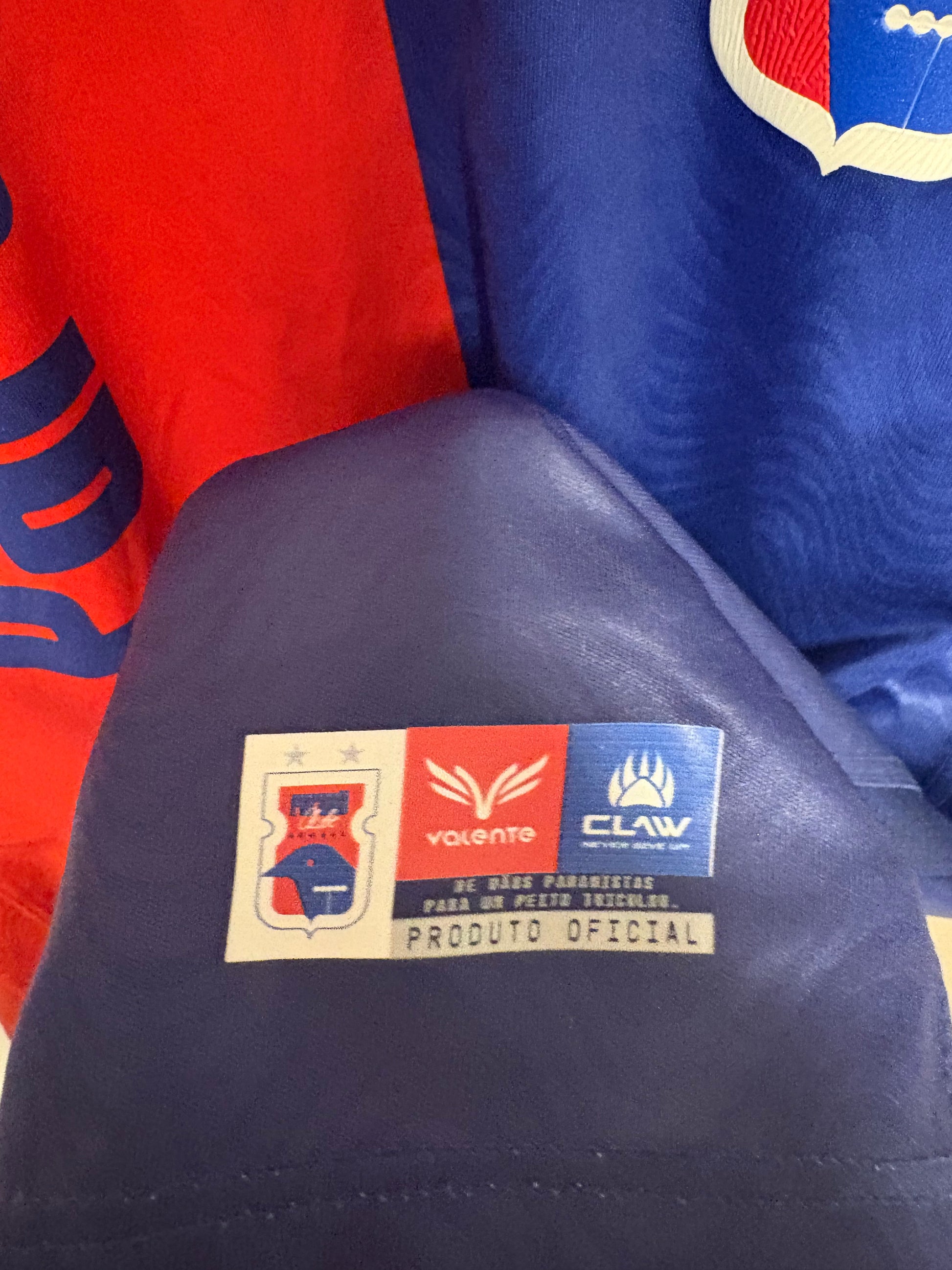Close-up of the Paraná Clube club crest and Claw branding on the 2024 home football shirt