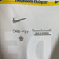 Close-up of Nike logo and Tottenham Hotspur club badge on white 24/25 home shirt
