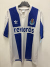 White and blue Adidas FC Porto home shirt  with visible branding on a light background