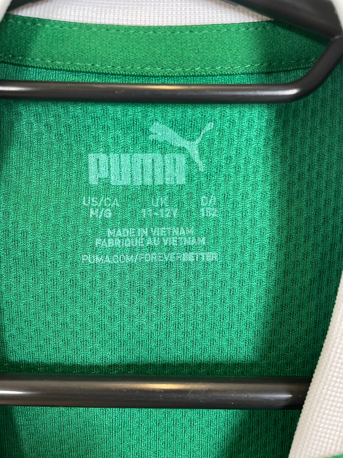 Close-up of Plymouth Argyle club badge and shirt details on 2024/25 Randell 20 kids jersey