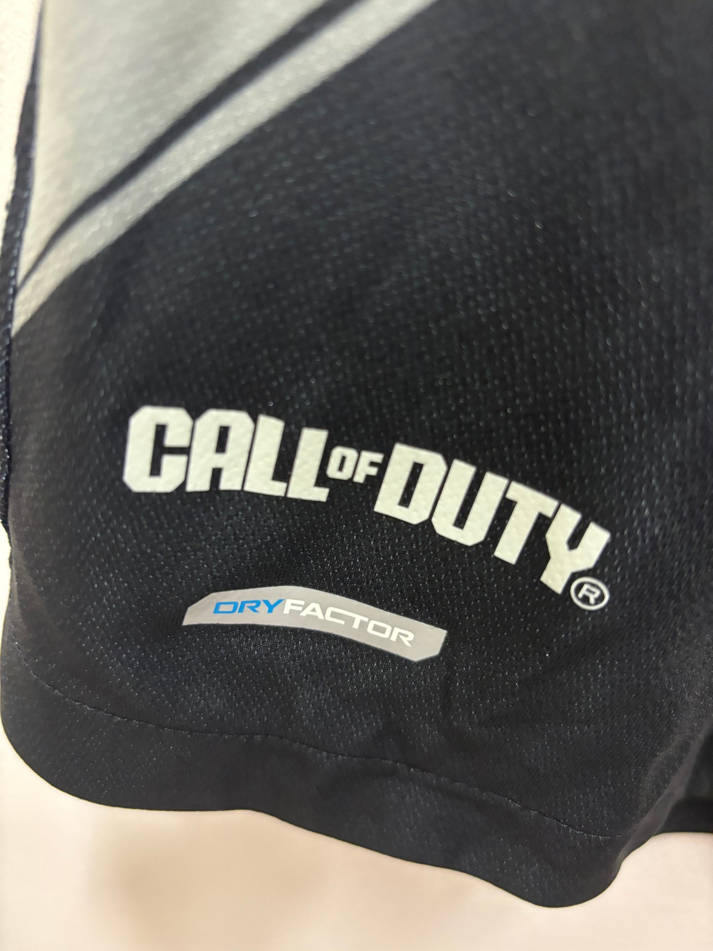 Black glove with 'Call of Duty' branding on a light background