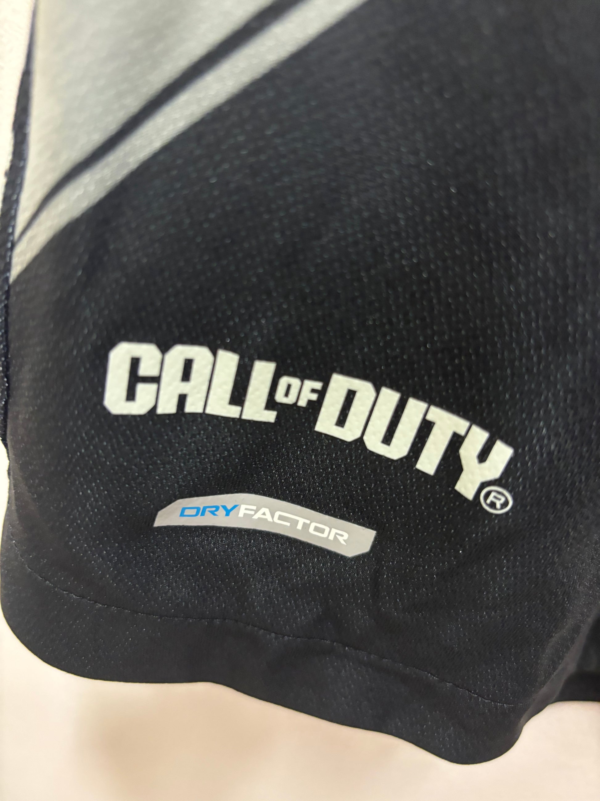 Black glove with 'Call of Duty' branding on a light background