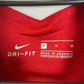 Close-up of Liverpool FC club badge and Standard Chartered sponsor on Nike 20/21 home shirt
