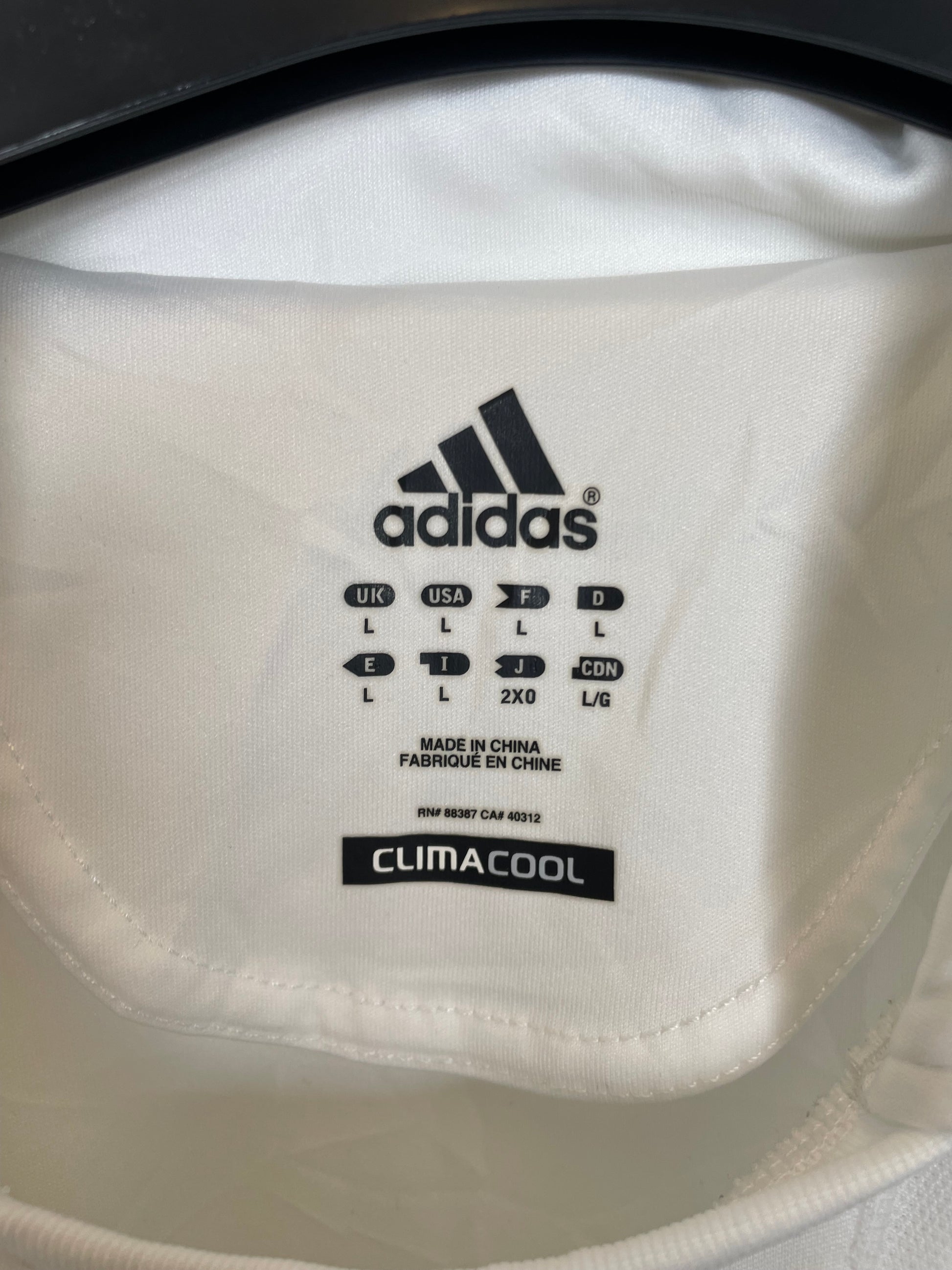 Close-up of Adidas climacool label on a white garment