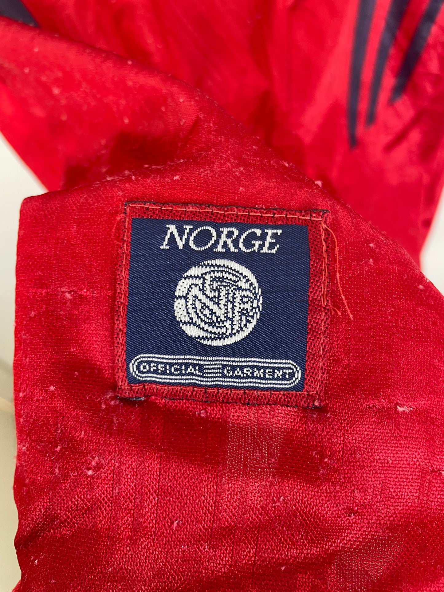 Adidas three stripes logo and brand label detail on Norway 1996 home football shirt collar area
