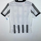 Back view of Juventus 22/23 kids home shirt showing plain design without player name or number