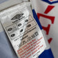 Close-up of a label on a sports jersey with visible branding.