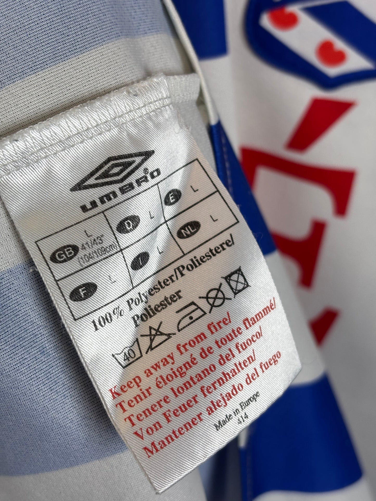 Close-up of a label on a sports jersey with visible branding.