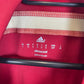 Spanish Football Federation badge and Adidas three stripes detail on 2014 World Cup home shirt