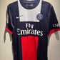 Paris Saint-Germain football jersey with Emirates logo on a textured surface