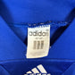 Close-up of Adidas logo and France national team badge on 1992 home shirt with Sauzee 8