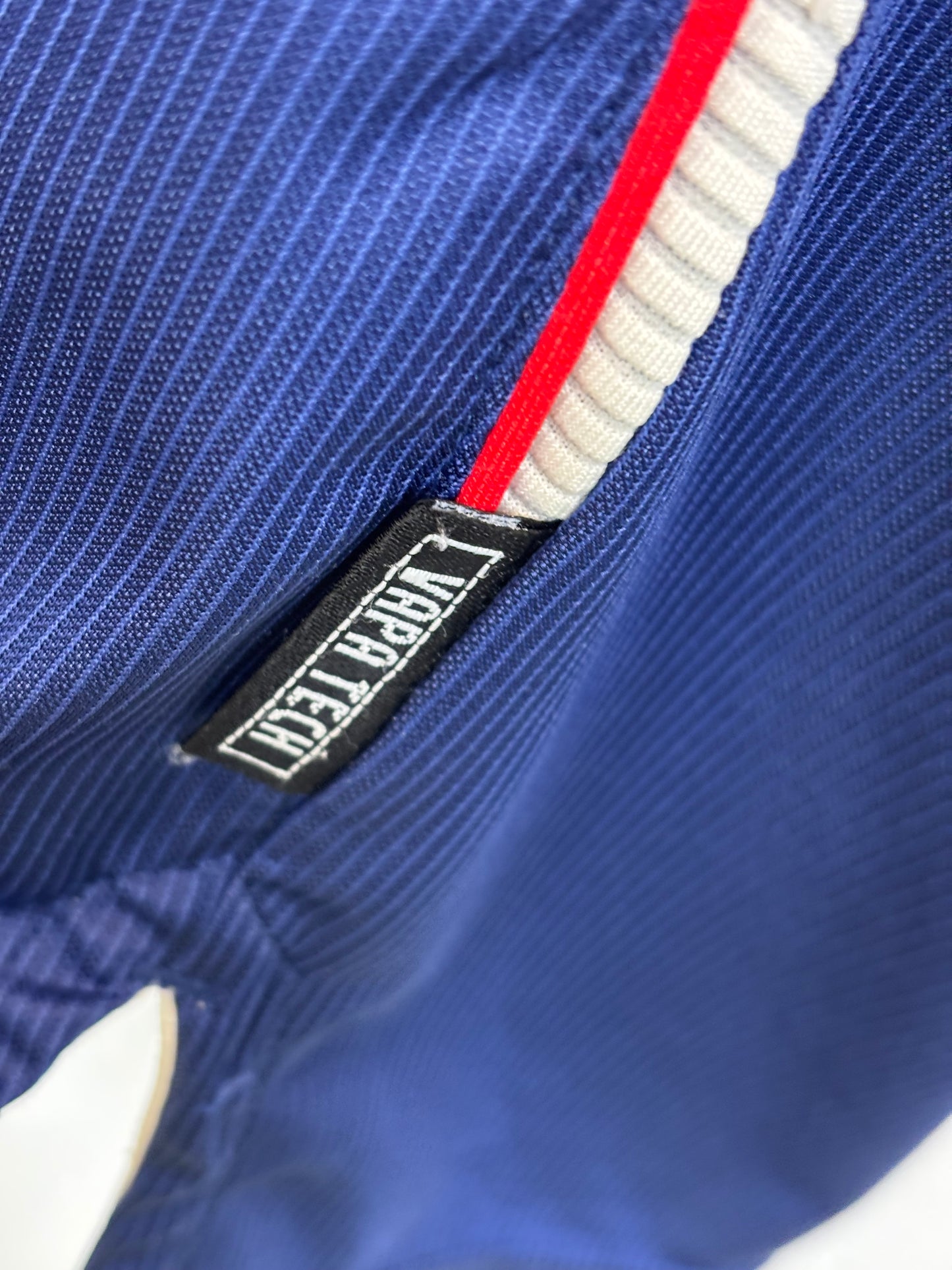 Fabric texture and material quality detail of Ajax 1999/2000 away shirt with Laudrup 10