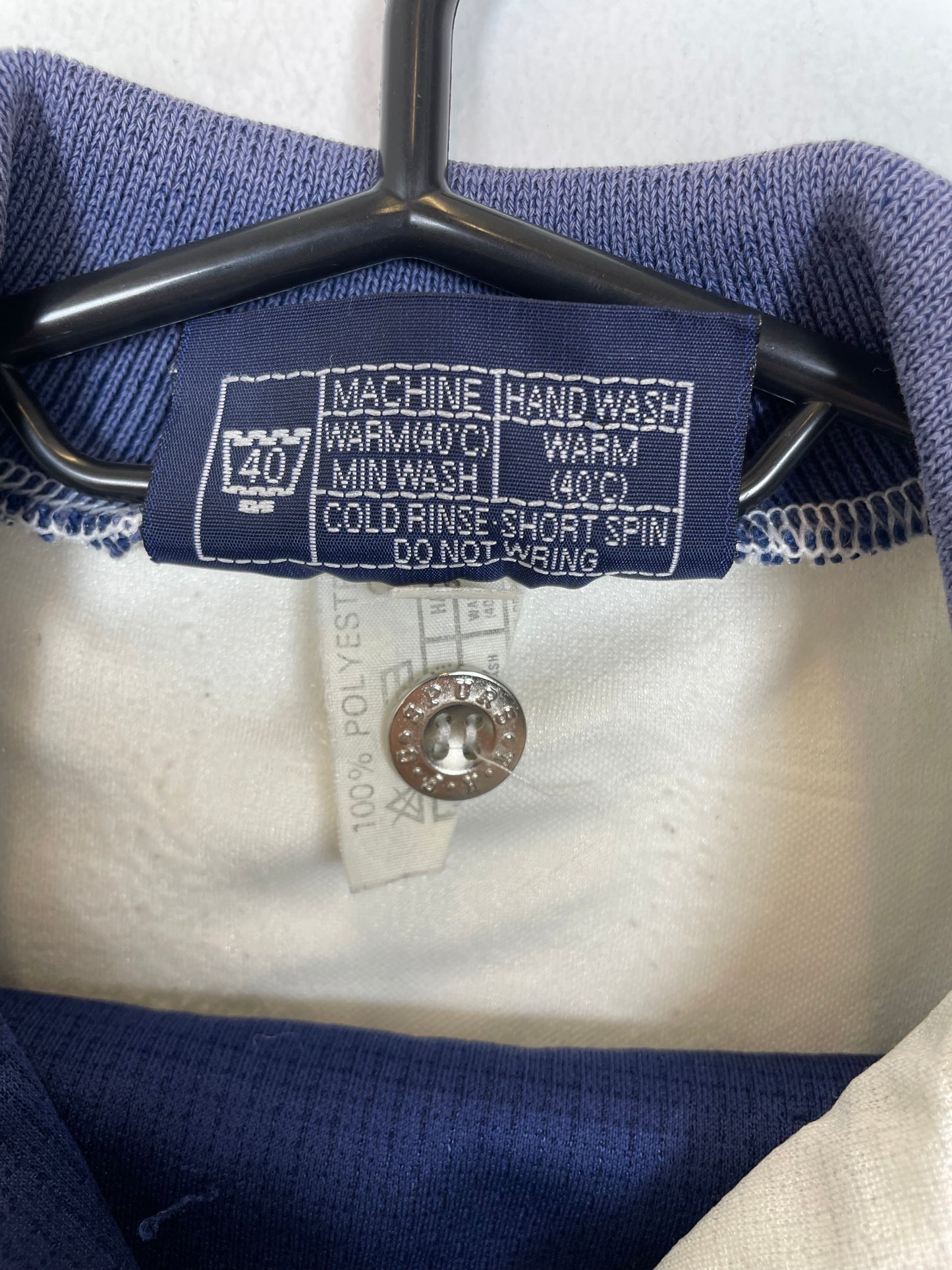 Close-up of Pony logo and Tottenham Hotspur club badge on vintage 1995-97 home shirt