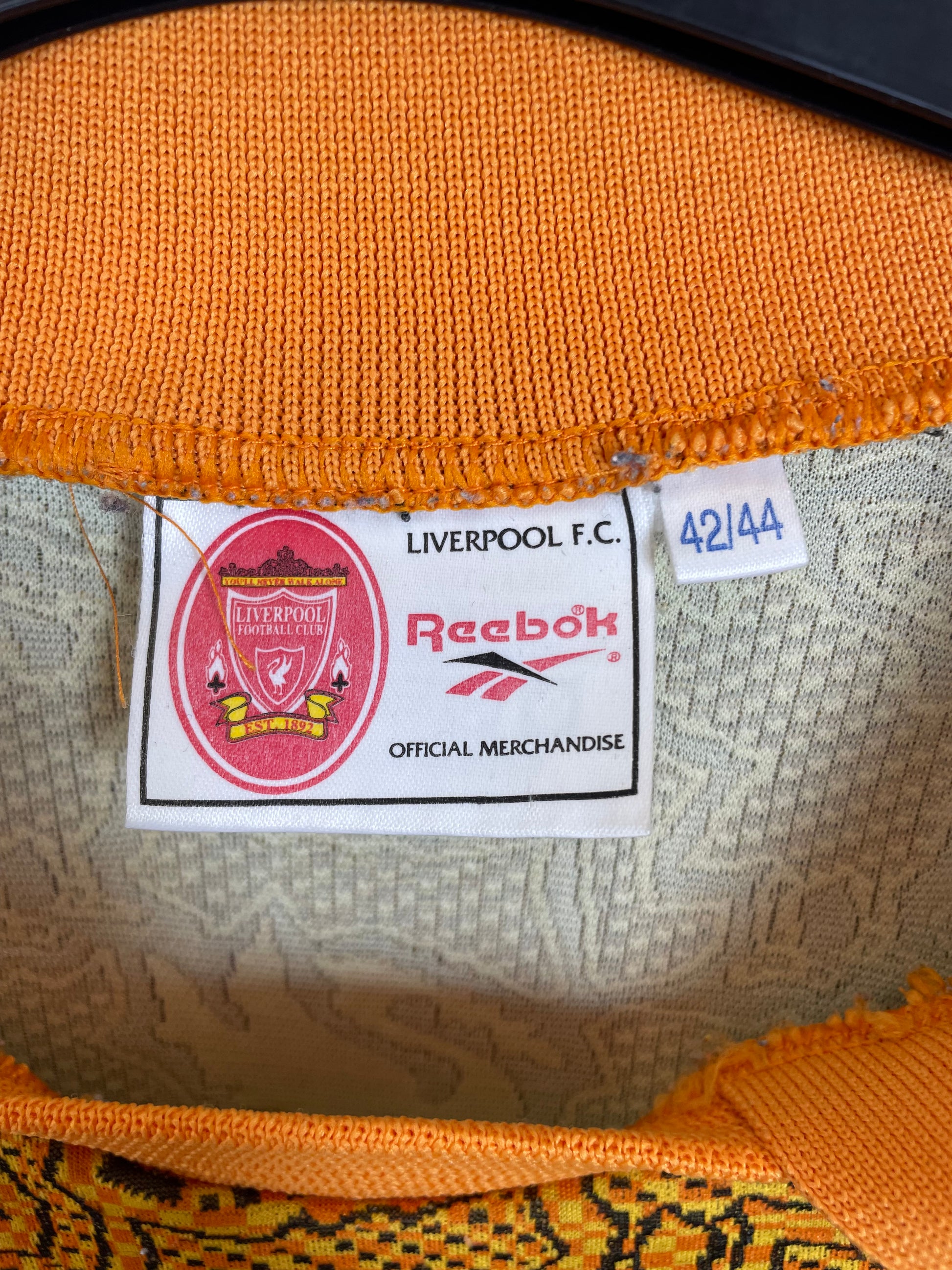 Close-up of Liverpool FC club badge and Reebok logo on 1998/99 away goalkeeper shirt