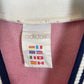 Close-up of Norway national team crest on Adidas 1996 home football shirt showing lion emblem detail