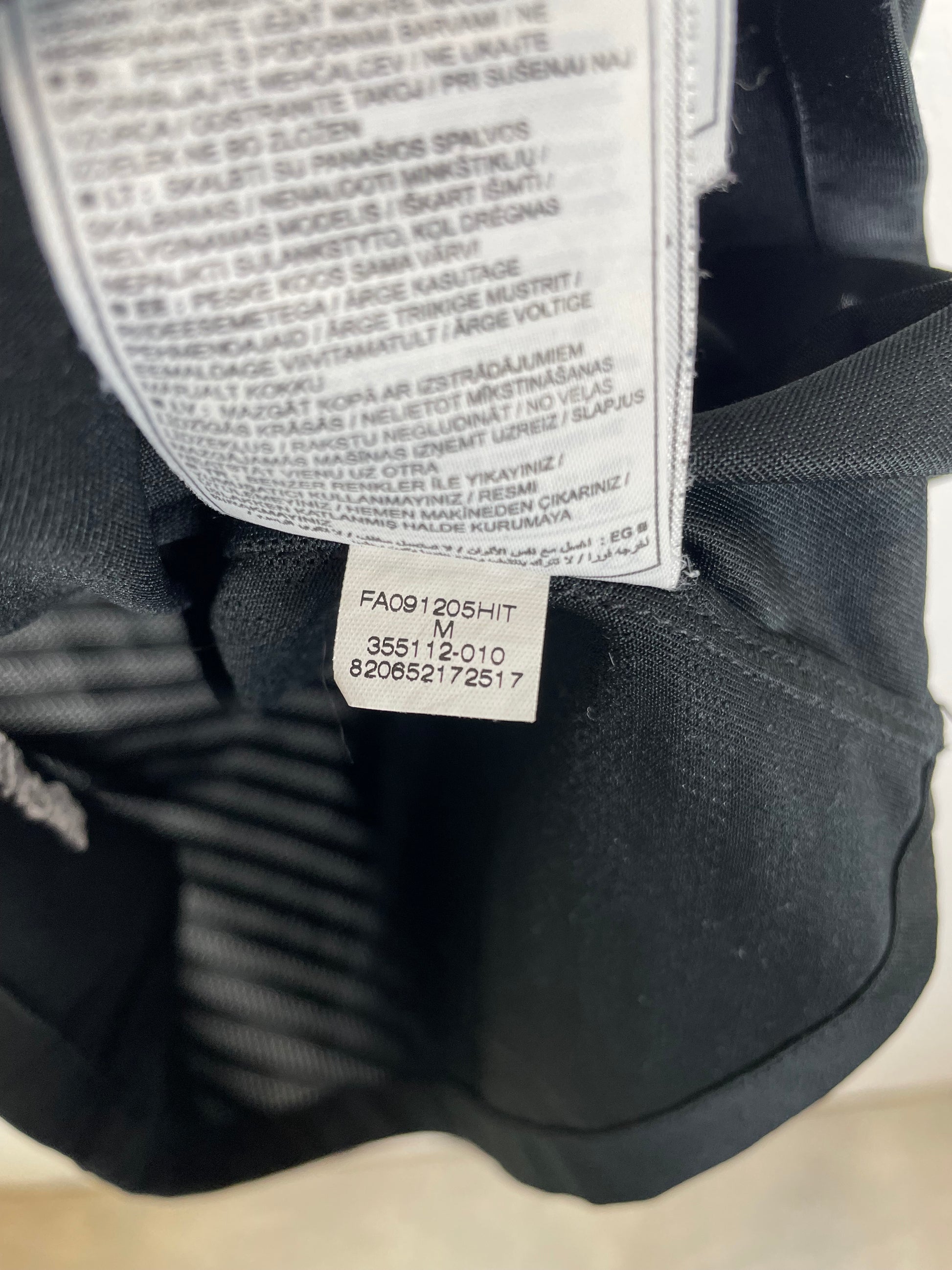 Interior sizing label and Nike manufacturer tag detail of Manchester United 09/10 away Macheda shirt