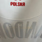 Close-up of Poland national team eagle crest and Nike swoosh on white 20/21 home jersey