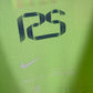 Close-up detail of FC Barcelona club crest and Nike logo on 2024/25 third jersey, mint condition