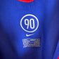 Close-up of Manchester United club crest and Nike swoosh logo on white 05/06 away shirt