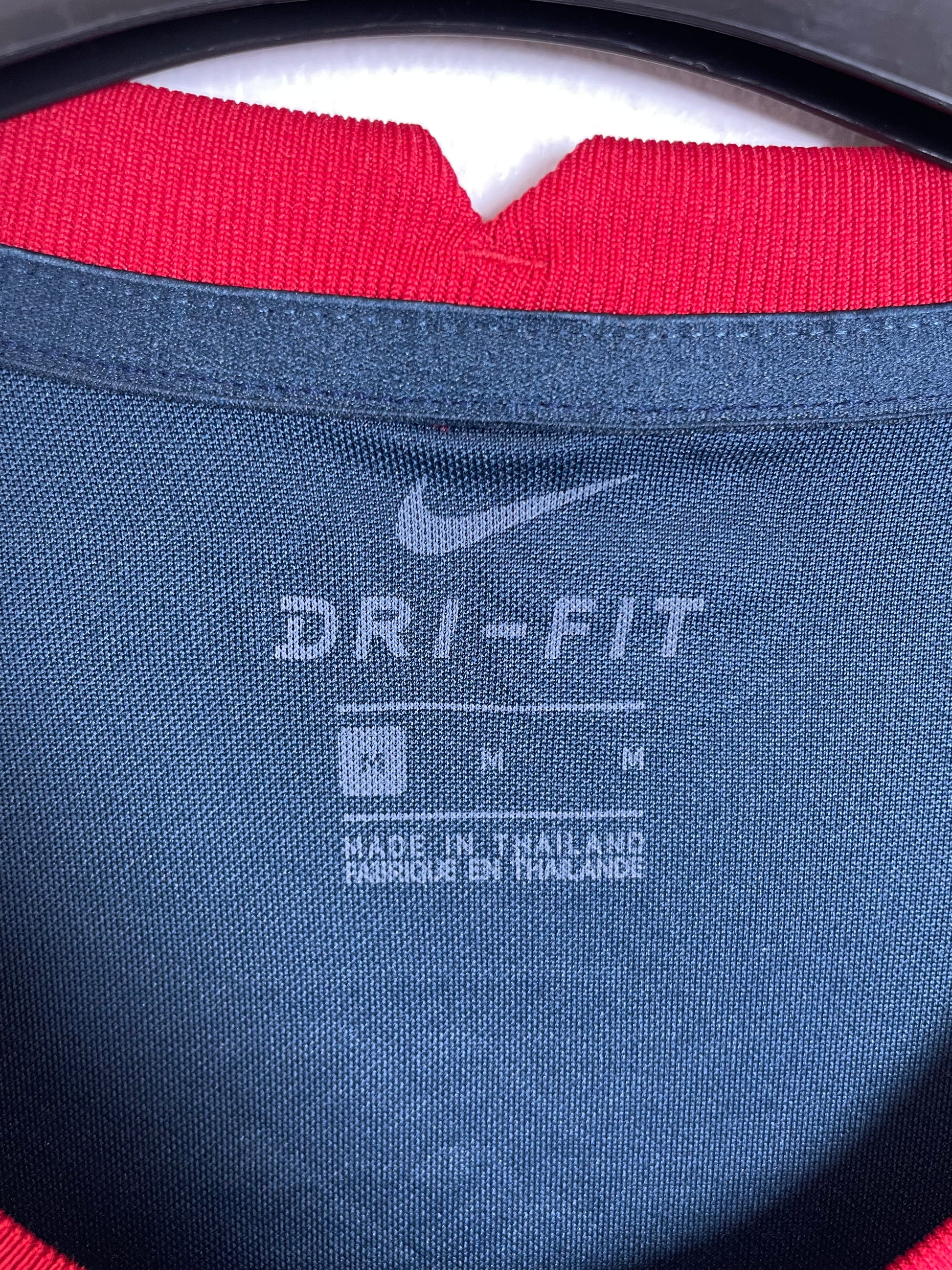 Close-up of Nike swoosh and Club América eagle badge detailing on 20/21 pre-match kit