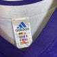 Close-up of Adidas logo and Real Madrid club badge on vintage 2002/03 third shirt