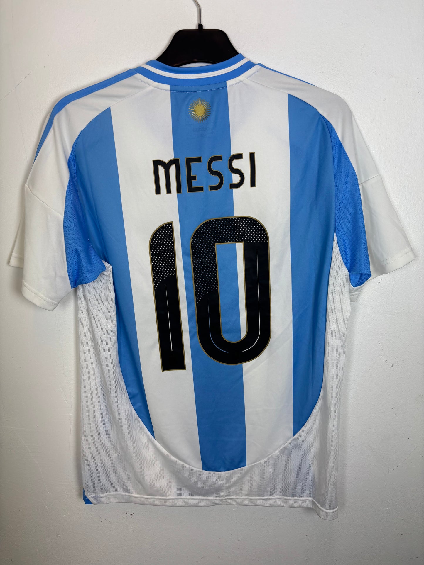 Back view of Adidas Argentina home shirt 2024 showing Messi name and number 10 in excellent condition