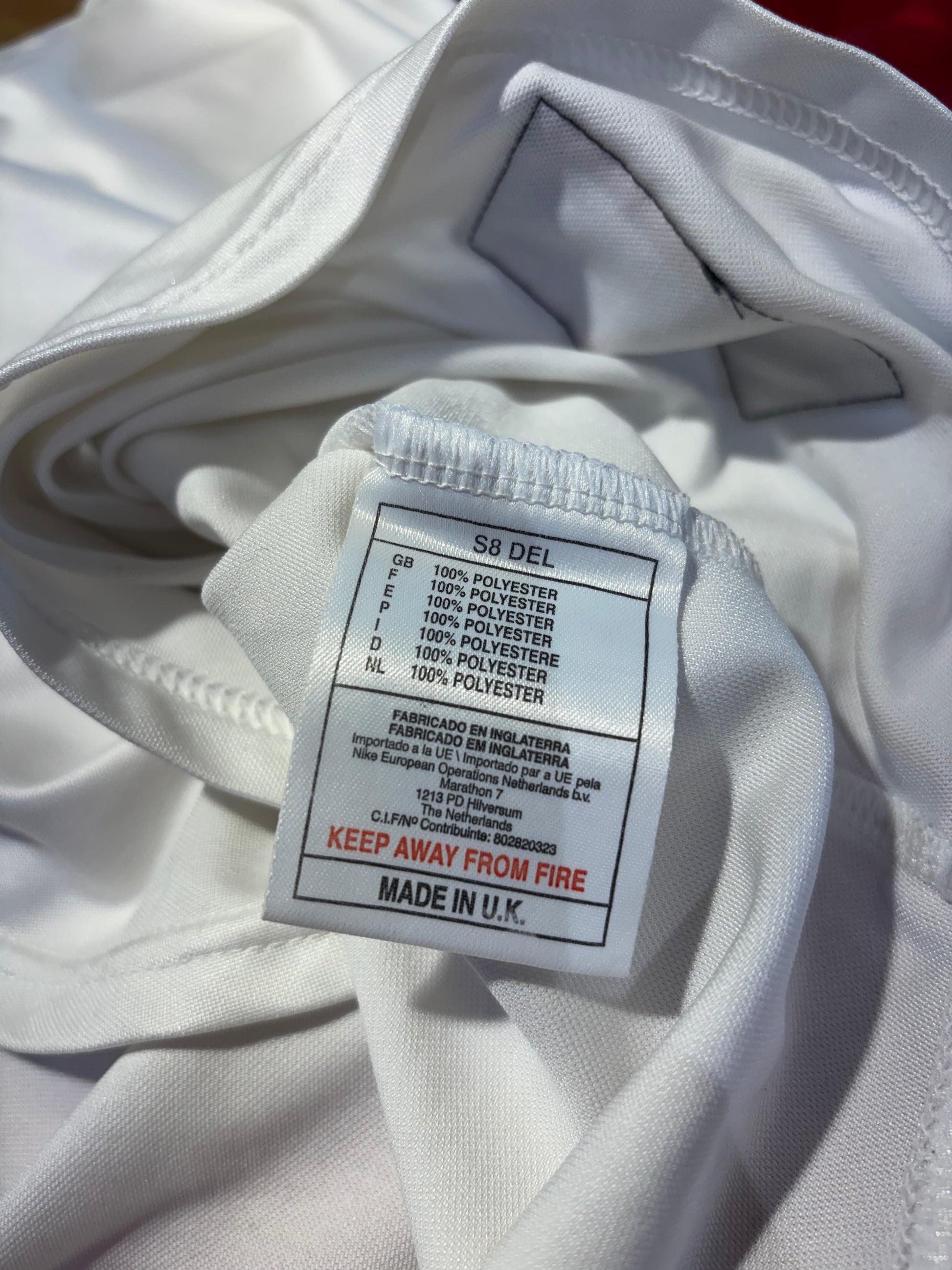 Nike swoosh logo and sizing tag detail on Poland national team 1998 home football jersey