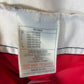 Interior Nike label and size tag showing authenticity details of Arsenal 99/00 Anelka home shirt