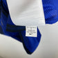 Nike swoosh logo and size tag detail on Manchester United 2011-13 away shirt collar area