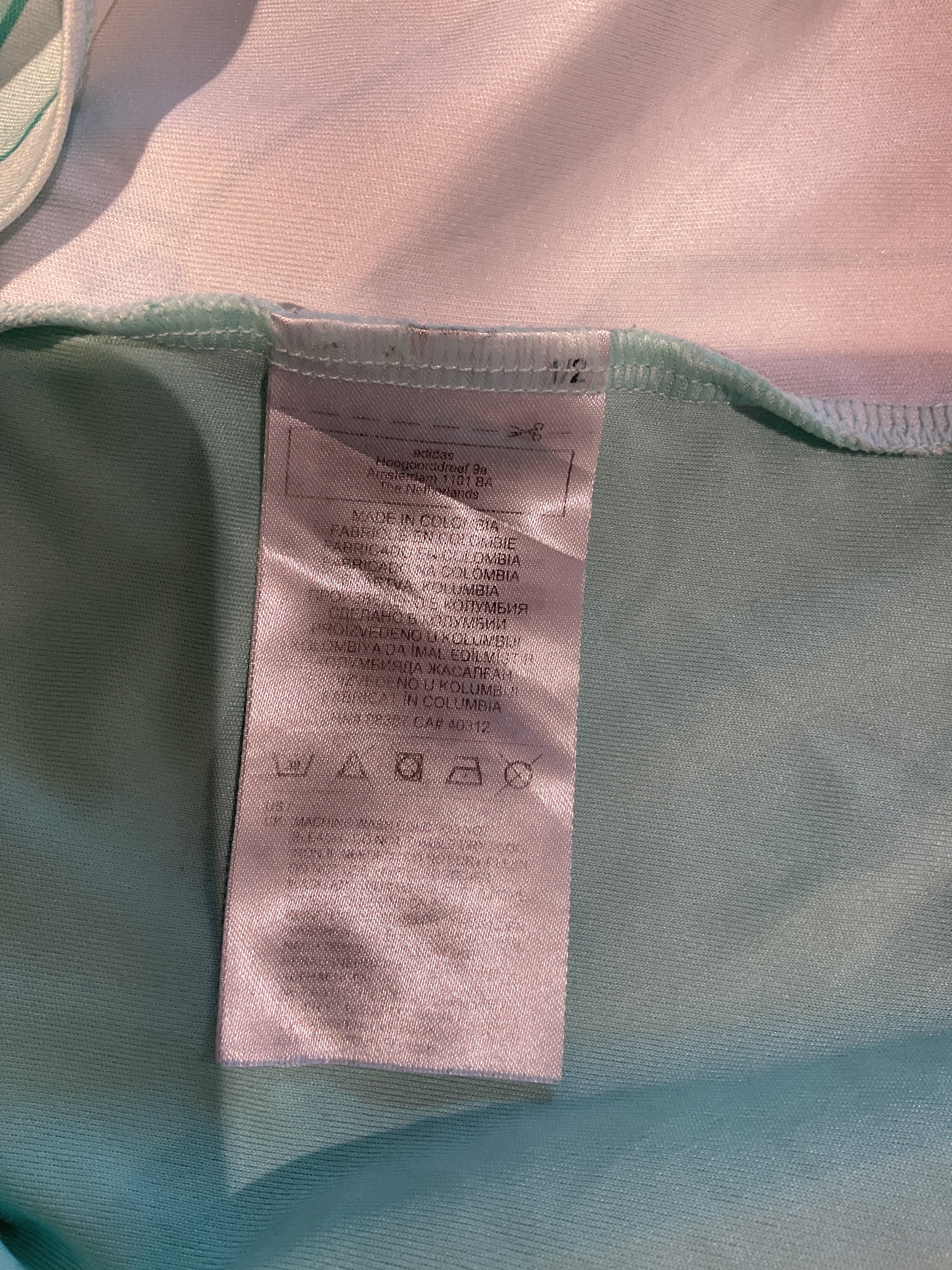 Close-up of a label on a green garment with a blurred background