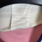 Fabric care label and sizing tag inside Adidas Norway 1996 home shirt showing authenticity details