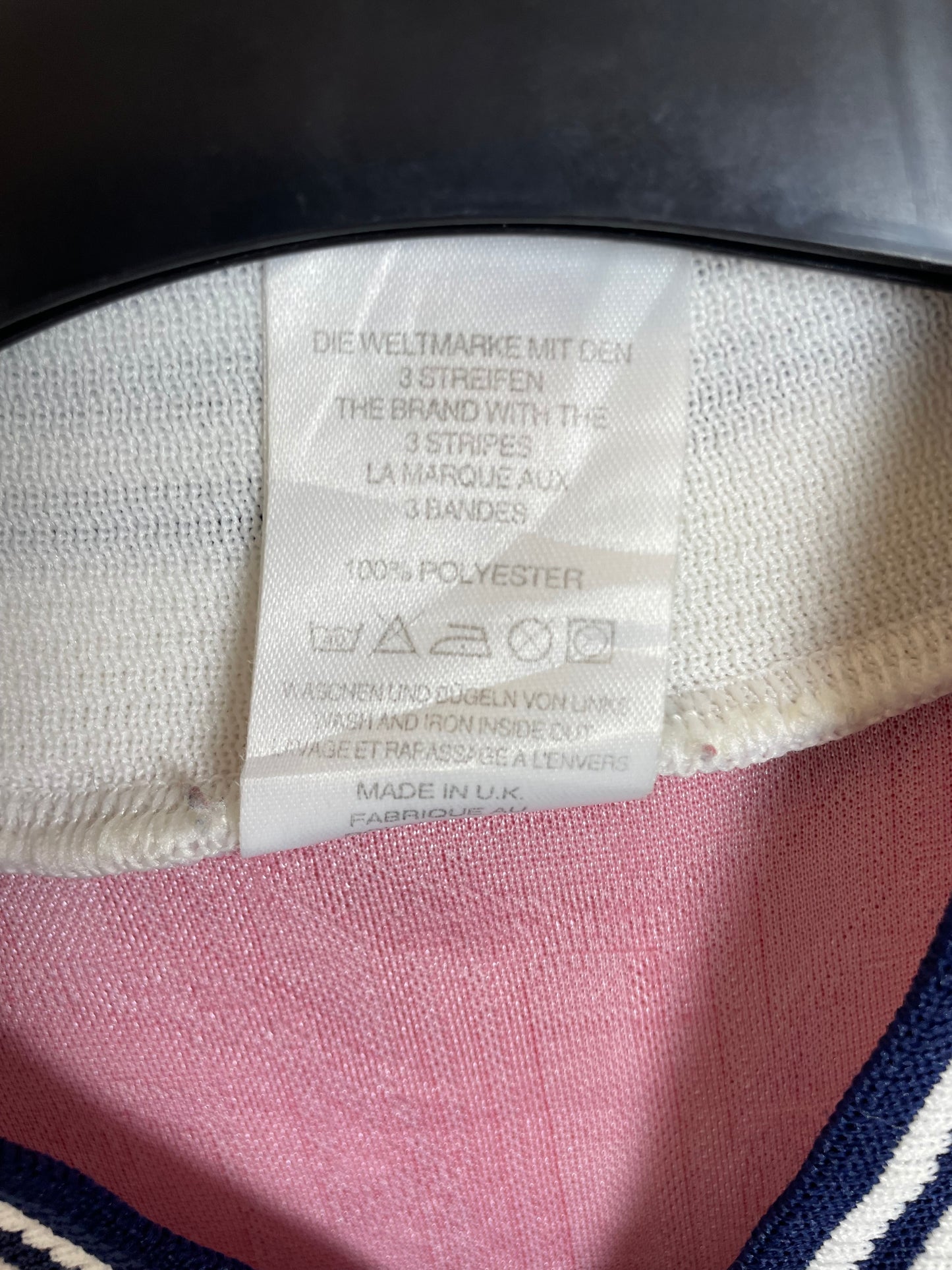 Fabric care label and sizing tag inside Adidas Norway 1996 home shirt showing authenticity details