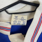 Close-up of the Macclesfield Town club crest on the 1989 FA Trophy winners kids shirt, detail shot from our store