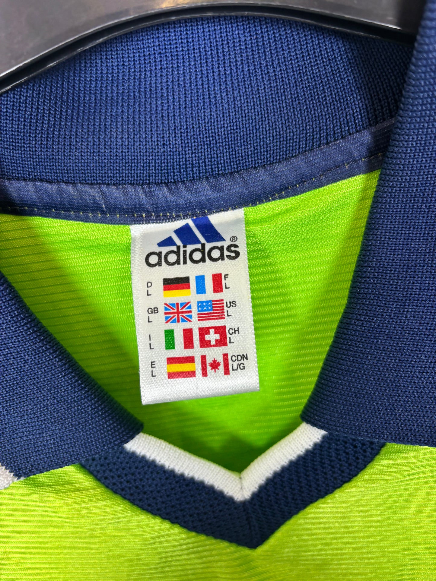 Close-up of Adidas logo and Fulham club badge on 1999/2000 away shirt with Horsfield 9