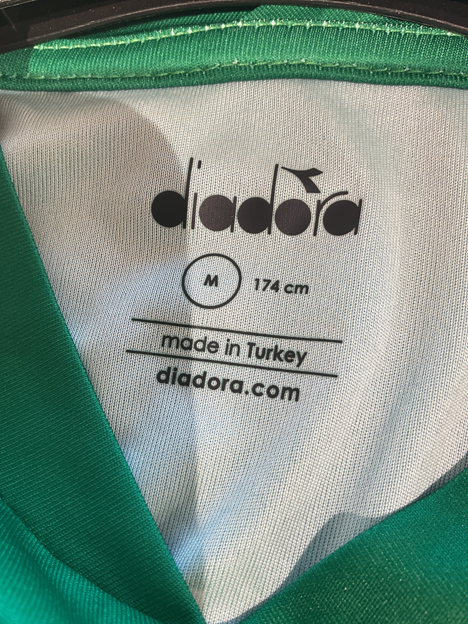 Diadora label on a green and white sports bag