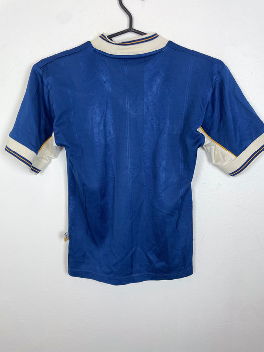 Front view of the retro Tottenham 97/98 kids away shirt showing the Spurs badge and sponsor, shown in full front detail