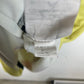 Nike size label and care instructions visible on Club América 20/21 yellow home shirt interior