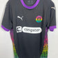 Puma FC St.Pauli 24/25 third shirt — front view in black with purple accents