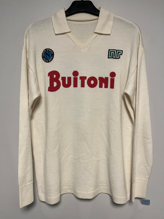 Beige long-sleeve football shirt with 'Buitoni' branding on a gray background