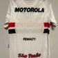White sports jersey with Motorola, Penalty, and Sao Paulo shirt on a gray background