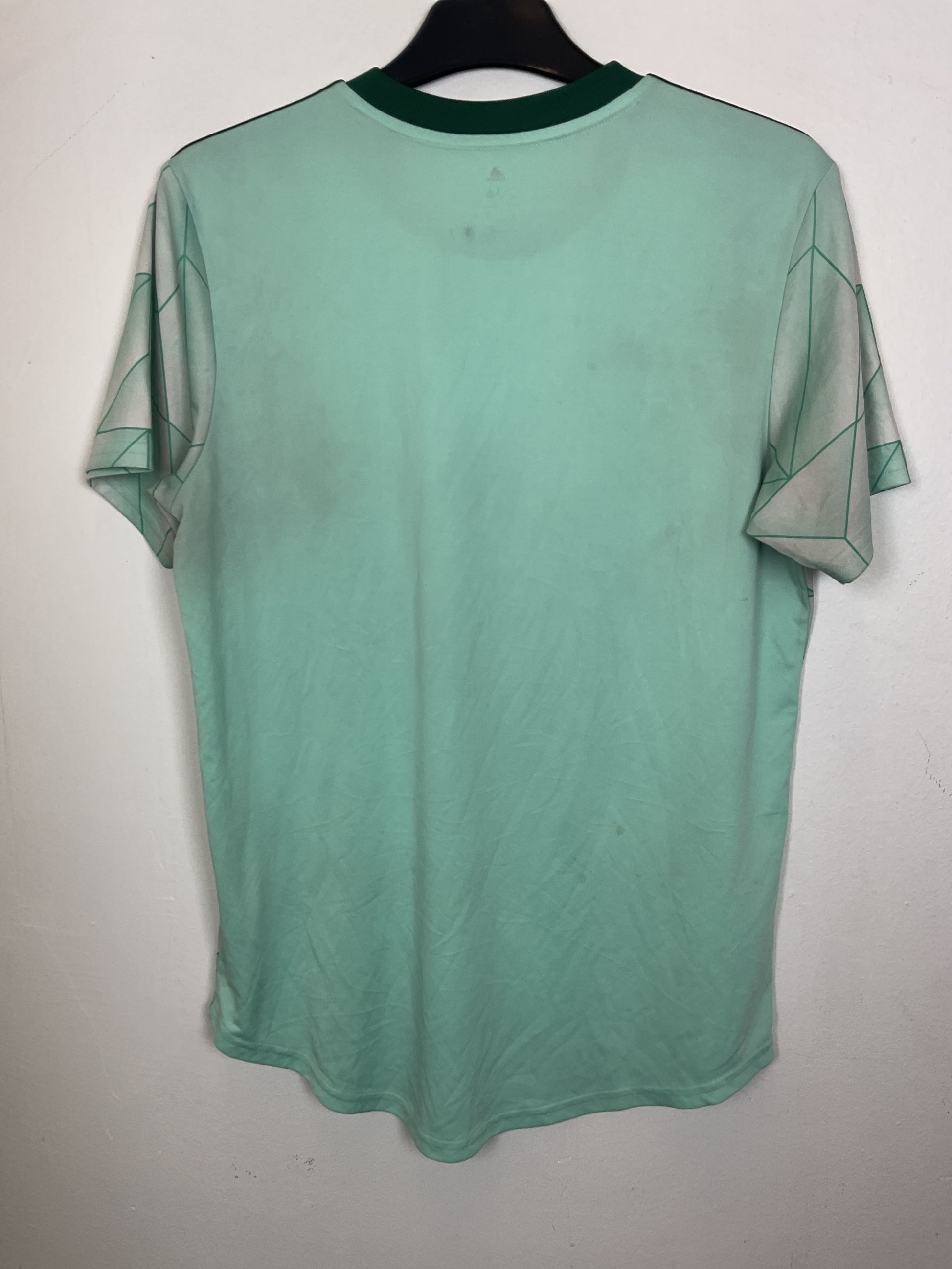 Green Adidas Atlanta United away jersey on a white background